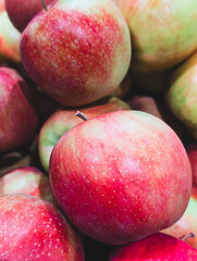 close-up of vibrant red and green apples pile