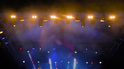 Colorful bright dynamic concert lighting for stage at nightclub. Illumination for entertainment, musical shows, parties, or performances at night. Nightlife, music, and entertainment concept - Powered by Adobe