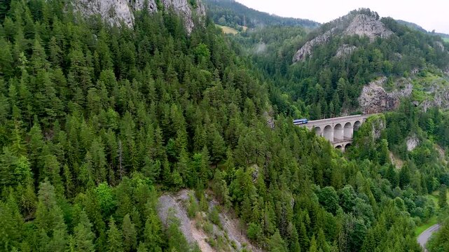 Semmering railway with running trains and surrounding mountain scenery, Lower Austria, Austria