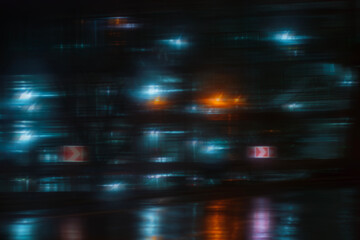 An abstract grid of blurry blue and orange bokeh lights, creating a modern, digital, or urban night...
