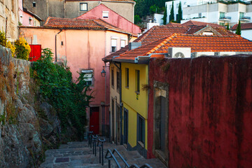 Fototapeta premium Colorful houses and stairs on the street in downtown of Porto, Portugal