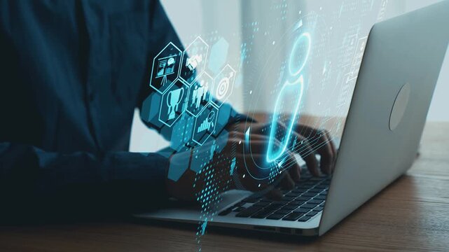 Professional business person using laptop with digital information graphics on the side for data analysis and technology development in modern office setting. Qubit.