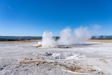 Clepsydra Geyser. Fountain Paint Pot Trail. Lower Geyser Basin in Yellowstone National Park. Hydrothermal System. hot-spring deposits. Extremophile. 
