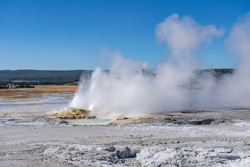 Clepsydra Geyser. Fountain Paint Pot Trail. Lower Geyser Basin in Yellowstone National Park. Hydrothermal System. hot-spring deposits. Extremophile. 
