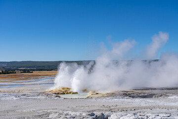 Clepsydra Geyser. Fountain Paint Pot Trail. Lower Geyser Basin in Yellowstone National Park. Hydrothermal System. hot-spring deposits. Extremophile. 
