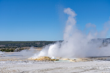 Clepsydra Geyser. Fountain Paint Pot Trail. Lower Geyser Basin in Yellowstone National Park. Hydrothermal System. hot-spring deposits. Extremophile. 
