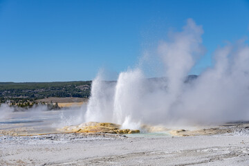 Clepsydra Geyser. Fountain Paint Pot Trail. Lower Geyser Basin in Yellowstone National Park. Hydrothermal System. hot-spring deposits. Extremophile. 
