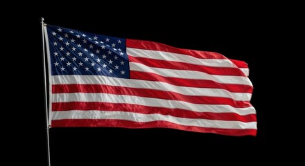 Obraz premium Waving American Flag Against a Black Background on a Pole