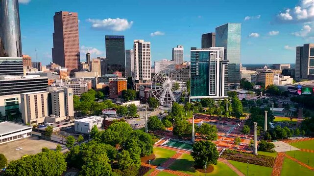 Vibrant aerial photo of Atlanta, Georgia showcasing downtown skyscrapers, Centennial Olympic Park, and green urban spaces. Perfect for real estate, travel, tourism, and business visuals