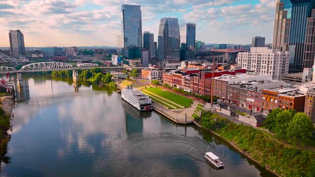 Sunrise panoramic view of Nashville, Tennessee with downtown skyscrapers and riverfront. Ideal for travel, tourism, business, real estate, and city lifestyle promotions