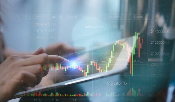 Woman sitting in cafe using tablet for analyzing data stock market in monitoring room with team pointing on the data presented in the chart, financial investment concept - Powered by Adobe