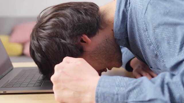 Young professional feeling depressed from work stress at home