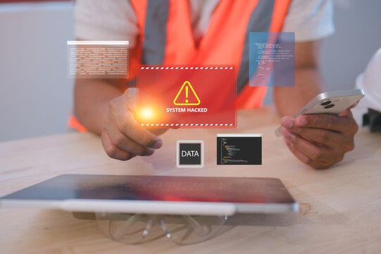 Close-up of engineer using smartphone with digital interface showing system hacked alert. Concept of cybersecurity, data breach, hacking, malware, cyberattack, and information security threat.
