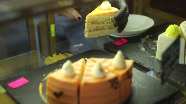Sweet Slice Delight: A close-up shot showcases a mouthwatering piece of cake being presented, the scene an ode to indulgence. capturing the art of dessert creation.