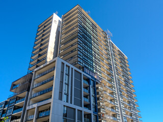 Obraz premium Residential and commercial Apartment building in inner west Sydney suburb , Sydney NSW Australia. Newly built apartment building in Wentworth point with modern Green eco friendly design