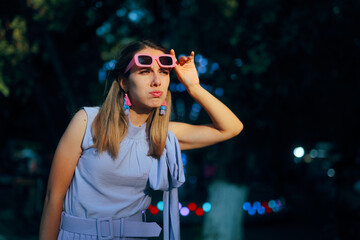 Curious Woman Lifts Her Sunglasses to See Better. lady frowning and squinting trying to observe...