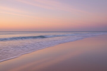 Pastel shore at golden hour with silky waves and glowing sky reflected on wet sand