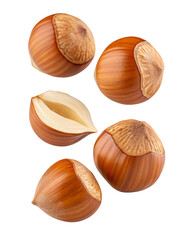 Healthy whole and halved hazelnuts scattered on a dark surface top view