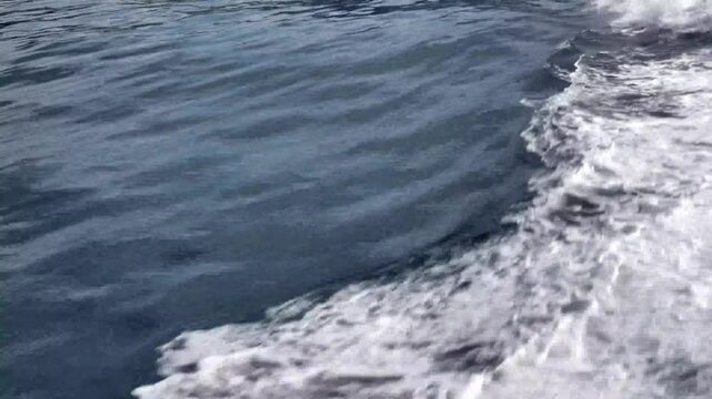 sea water surface with waves and boat wake