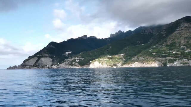 scenic amalfi coast with boats and mountain landsc