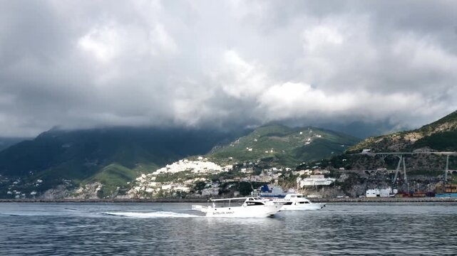 scenic amalfi coast with boats and mountain landsc