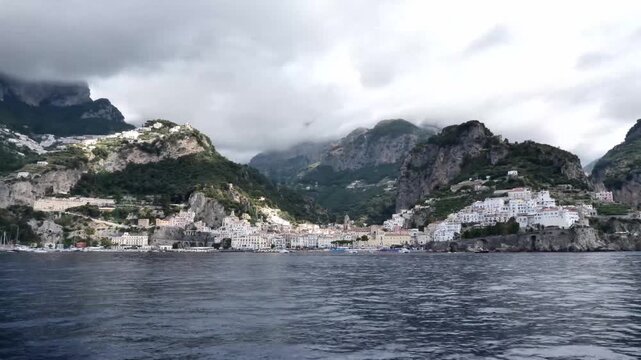 scenic amalfi coast with boats and mountain landsc