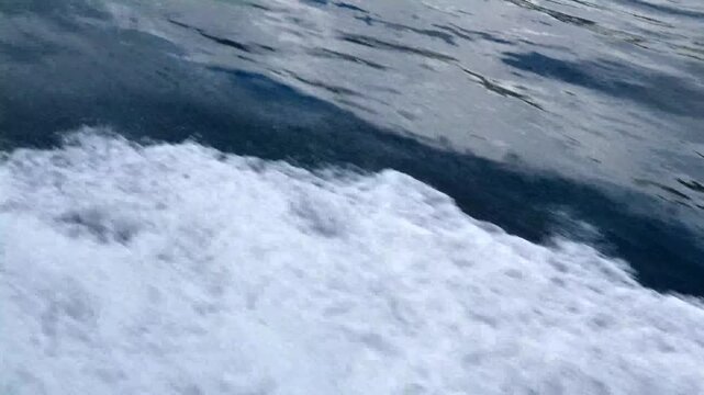 sea water surface with waves and boat wake