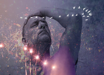 Young man on the beach looking worried or anxious.