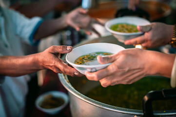 volunteers give food to local poor people, Feeding the poor Help them relieve hunger