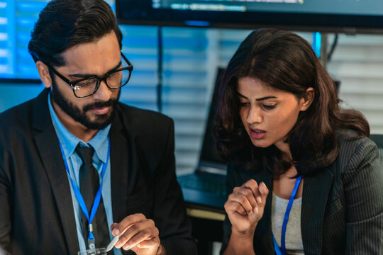 Software Developers Discussing Code - Powered by Adobe