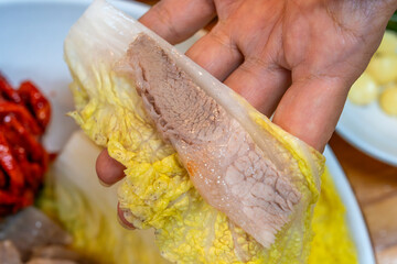 a piece of boiled pork on the napa cabbage
