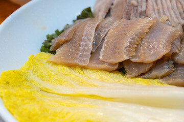 napa cabbage kimchi and fermented skate slices in Samhap cuisine