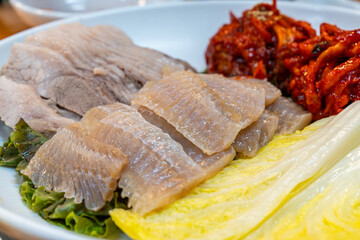Skate samhap cuisine composed of boiled pork, fermented skate and kimchi