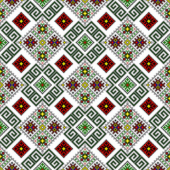 A colorful seamless geometric pixel art textile pattern with intricate cross-stitch motifs. Vector pixel art geometric pattern creating a vibrant traditional design
