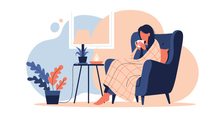 A person wrapped in a blanket drinking a warm beverage.