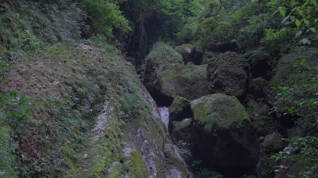 A series of shots of mountain gorges, river valleys, and streams flowing.