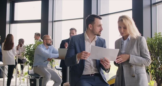 Business professionals at work. People meet in a modern office workplace, make new connections, cooperate, exchange project ideas, discuss partnership opportunities