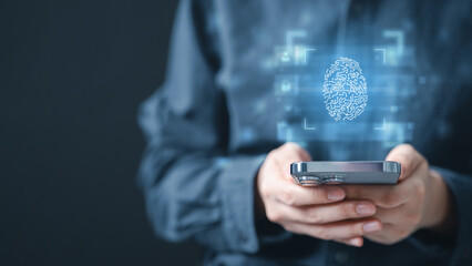 Person holding smartphone with virtual fingerprint scan, concept of passkey, passwordless login,...