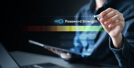 Person using tablet and drawing virtual password strength meter, concept of strong password...