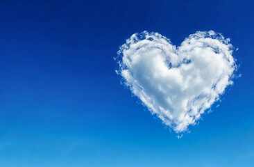 fluffy white heart shaped cloud in blue sky with text area