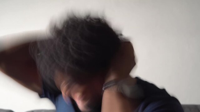 Stressed man shaking head with motion blur