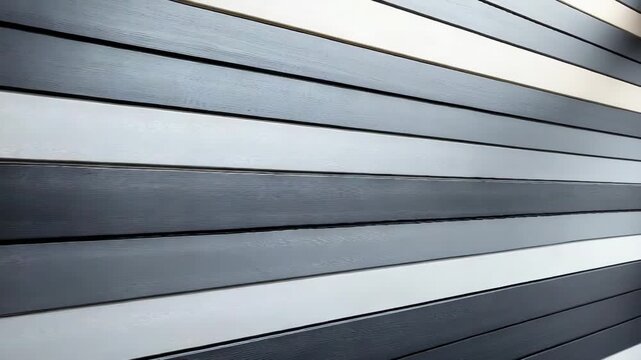 Modern wooden staircase with sleek black and white steps in contemporary design