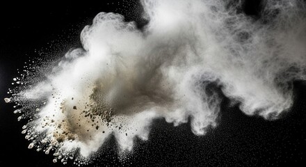 A cloud of white and grey powder and particles explodes outward against a black background