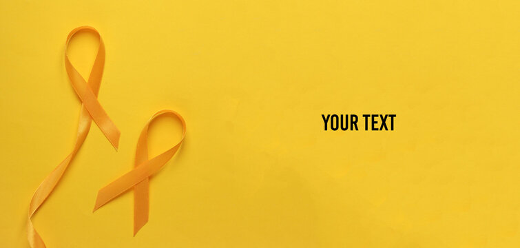 Yellow ribbons, childhood cancer awareness day symbol. Copy space for your text - Powered by Adobe