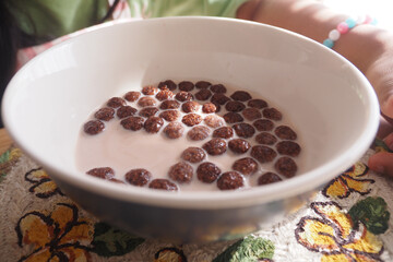 Crunchy cereal bowl with milk enjoyed at breakfast time