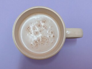 Malaysian Teh Tarik or Hot Milky Drink Served in a Traditional Cup. Mug of Frothy Hot Drink with Subtle Foam Texture
