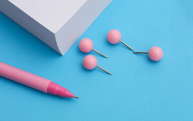 Many different stationery items on blue background. School, student, office supplies. Top view. Flat lay. Creative layout