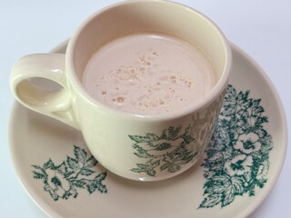 Malaysian Teh Tarik or Hot Milky Drink Served in a Traditional Cup. Mug of Frothy Hot Drink with Subtle Foam Texture