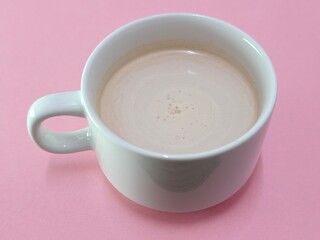 Malaysian Teh Tarik or Hot Milky Drink Served in a Traditional Cup. Mug of Frothy Hot Drink with Subtle Foam Texture