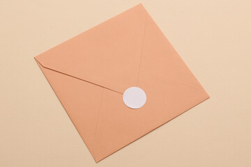 Envelope with white round sticker close up